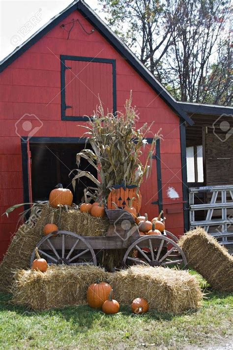 A Fall Scene Red Barn Wooden Wagon Straw Hay Pumpkins Halloween