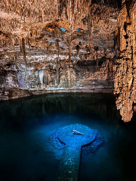 A Blue Hole In The Middle Of A Cave