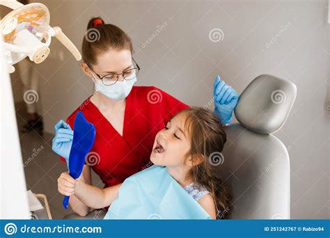 Children Dentistry Dentist And Child Patient Consultation With Child