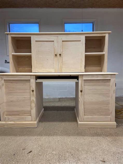 The design of this free desk plan by ana white is inspired by restoration hardware's sawhorse trestle desk. Computer Desk with hutch | Ana White