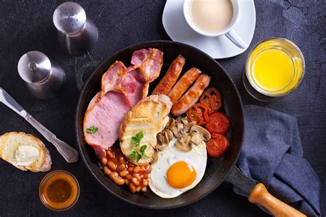 Full English Or Irish Breakfast With Sausages Bacon Eggs Tomatoes