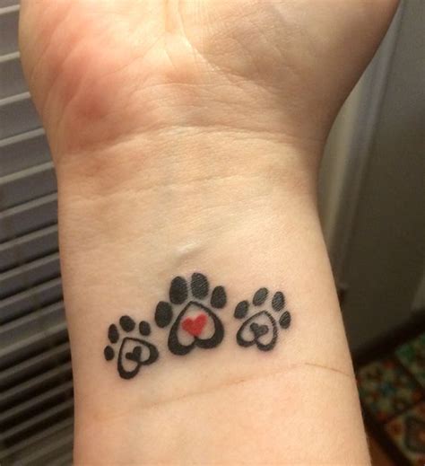 The Cutest Paw Print Tattoos Ever Pawprint Tattoo Print Tattoos Wrist Tattoos For Women