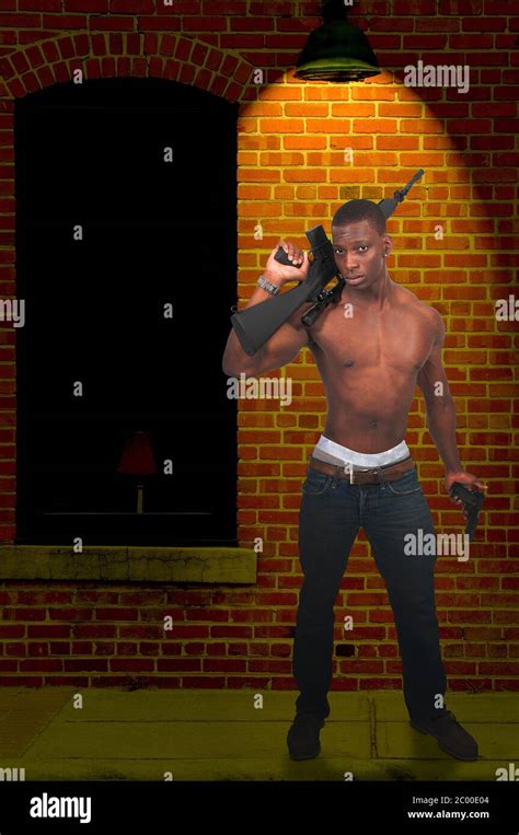 Man With Assault Rifle And Handgun Stock Photo Alamy