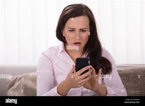 Person Shocked At Phone Hi Res Stock Photography And Images Alamy