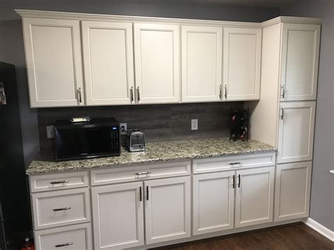 Choose matching hardware, mirrors, medicine cabinets and other accessories in various finishes and styles from the sassy collection by White lowes cabinets with grey vinyl flooring for ...