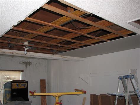 Fixture is recessed the thickness. Water damaged drywall ceiling removed