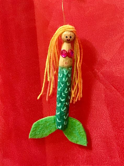 peg clothespin mermaid ornament with decoupaged tissue paper felt chalk marker embellished tail