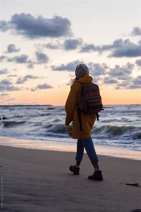 Woman Walking On Sandy Shore Del Colaborador De Stocksy Danil Nevsky Stocksy