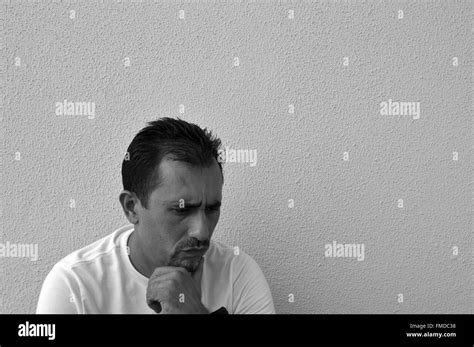 Sad Latino Man Thinking Textured Wall Background Stock Photo Alamy