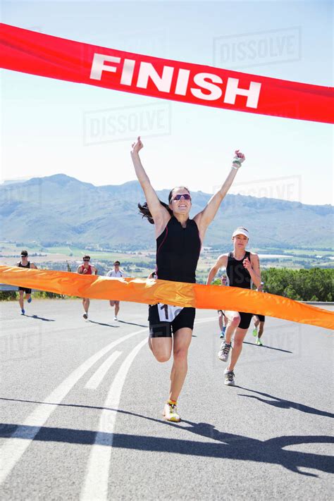 Runner Crossing Race Finish Line Stock Photo Dissolve