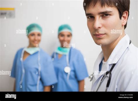 Satisfied Doctor With Two Nurses Stock Photo Alamy