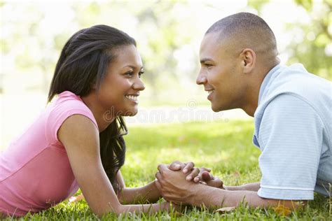 Portrait Of Romantic Young African American Couple In Park Stock Image