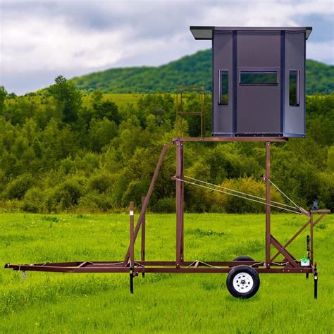 An Outhouse Sits In The Middle Of A Grassy Field