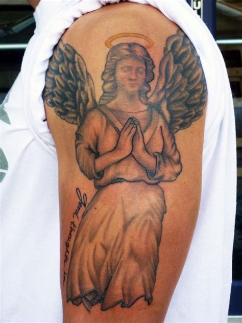 Angel vs evil tattoo on back shoulder for men. 60 Best Angel Tattoos - Meanings, Ideas and Designs for 2019