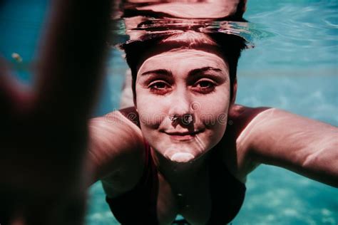 Portrait Of Young Woman Diving Underwater In A Pool Summer And Fun Lifestyle Stock Image