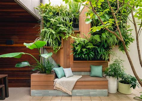 Wall Planters Provide A Low Maintenance Garden For This Small Courtyard