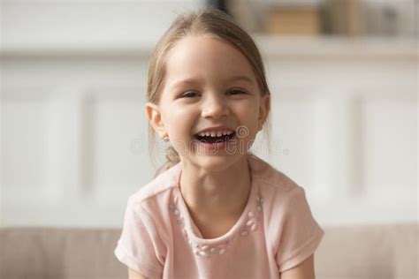 Funny Adorable Little Girl Laughing Looking At Camera Headshot