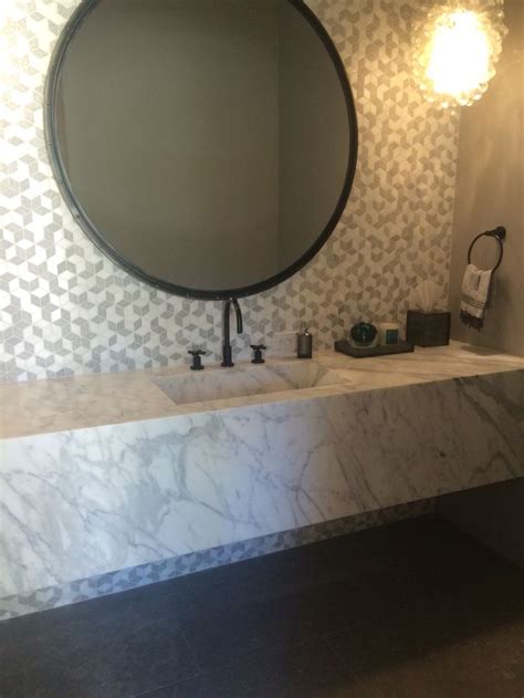 These marbled trough sinks had a very busy combination of exposed aggregate and contrasting color marbling. Carved marble trough sink | Round mirror bathroom ...