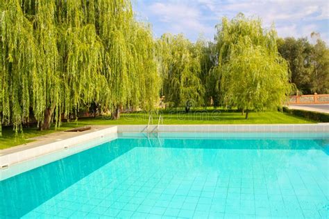 Turquoise Water In A Large Outdoor Pool In The Park Area Stock Photo