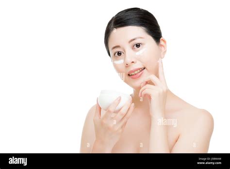 The Skin Is Smooth Chinese Asian Girl Use Sun Cream Below Eyes To Prevent Sunburn Isolated On