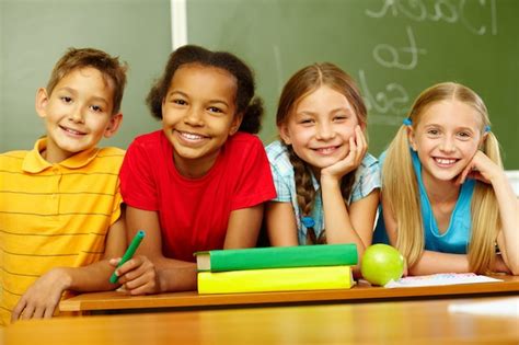 Smiling Primary Students Sitting In Class Photo Free Download