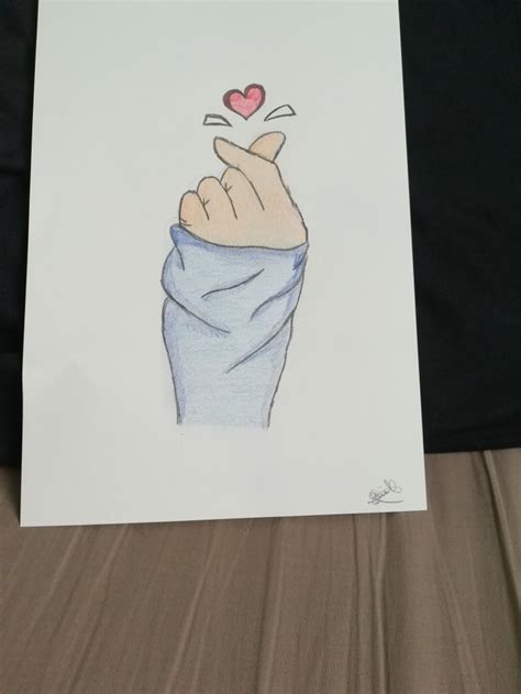 A Drawing Of A Hand With A Heart On Its Finger Holding Up A Blanket