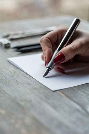 Womans Hand Writing On White Paper Stock Photo Download Image Now