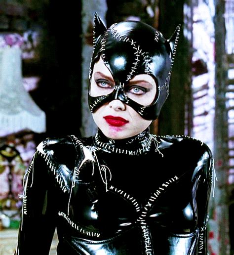 A Woman In Black Cat Suit With Red Lips