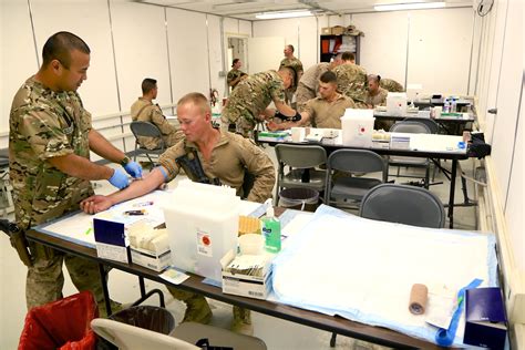 Us Sailors Draw Blood From Us Marines During A Walking Blood Bank