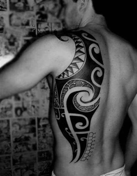Flowing #koru curves and #traditional #tribal patterns. 60 Tribal Back Tattoos For Men - Bold Masculine Designs