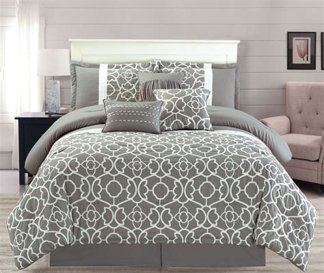 If you're going for a complete overhaul, add matching sheets, drapes and other accents. 7 Piece Ladera Gray Comforter Set