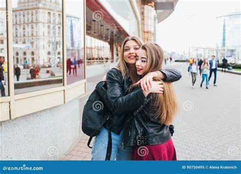 Happy Meeting Of Two Friends Hugging In The Street Stock Image Image