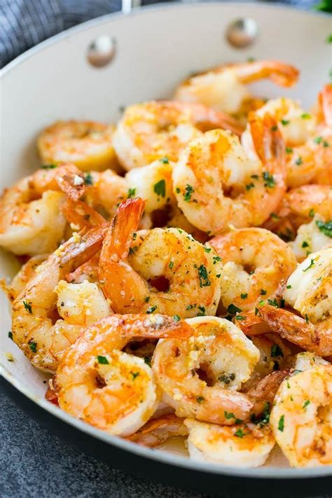 A Pan Of Garlic Butter Shrimp In A Savory Sauce Finished Off With