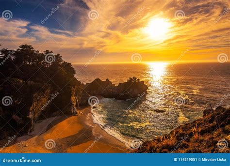 Sunset Over Mcway Falls On Pacific Coast Highway In California Stock