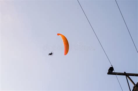 Red Parachute With Paraglider And Electricity Wire Stock Photo Image