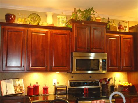 But first i want to decorate above the kitchen cabinets. Tricky Space Above the Cabinets - Traditional - Kitchen ...