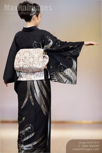 Photo Of Back Of A Japanese Woman Wearing Elegant Black Kimono With Obi