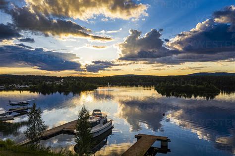 Finland Lapland Inari Dramatic Sunset Over Jetties On Shore Of Lake