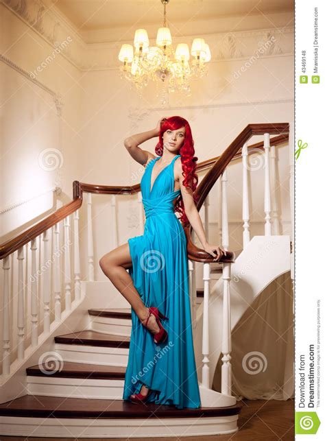 Young Woman With Luxurious Long Beautiful Red Hair In A