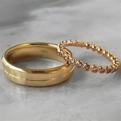 The classic gold ring with name engraving on would make your geeky wedding band engraving ideas. French Wedding Ring Engraving Ideas #engravedweddingrings ...