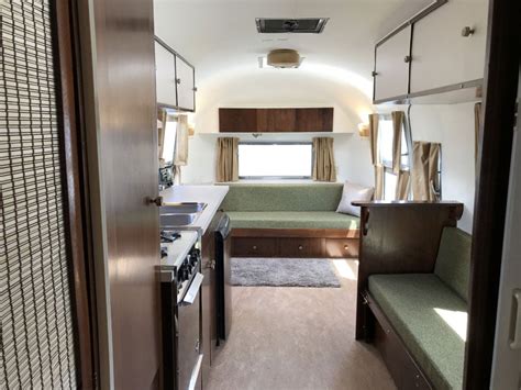 Silver Capri Tows The Golden Airstream Truck Camper Magazine