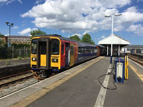 Class 153 Dmu 153381 And A Class 158 Dmu Stand At Skegness Station On
