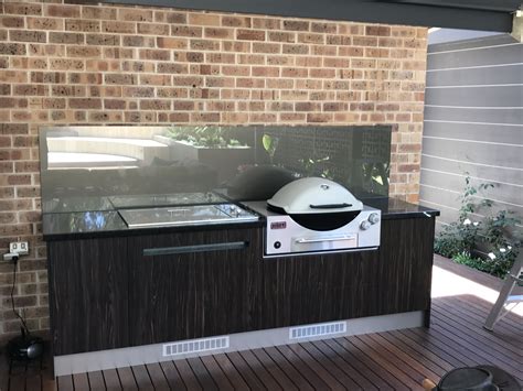 Outdoor kitchen and bar designs. Outdoor Kitchen with Laminex Doors, Weber Family Q and ...