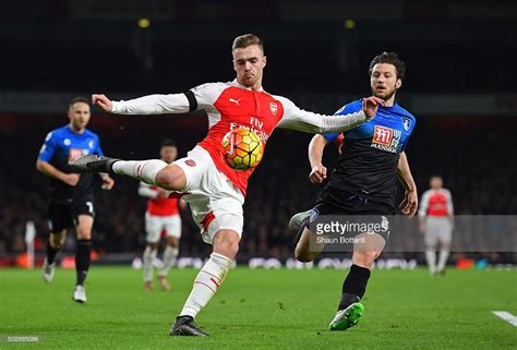 Calum Chambers Of Arsenal And Harry Arter Of Bournemouth Compete For