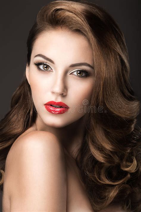 Beautiful Woman With Evening Make Up Red Lips And Curls