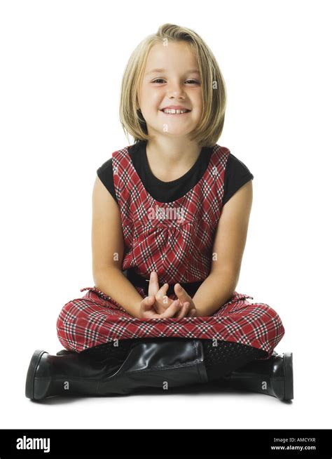 Girl Sitting Cross Legged Smiling Stock Photo Alamy