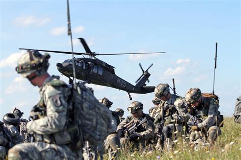 173rd Airborne Brigade Paratroopers Air Assault Through Mock Village