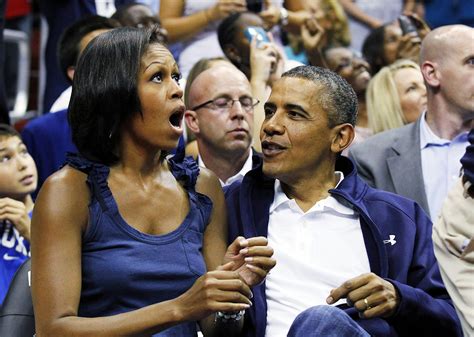 Write Your Own Caption The Obamas Appear On The Kiss Cam