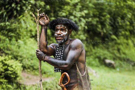 Portrait Of Dani Tribe Man Wearing Koteka Traditional Clothes Of Papua Dani Tribe Men Ready To