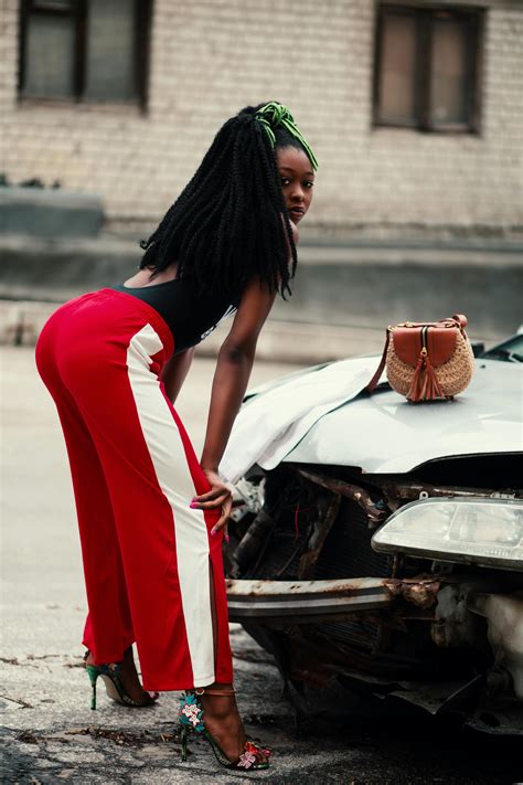 Photograph Of Woman About To Twerk In Front Of Vehicle · Free Stock Photo